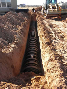 Installation of plastic infiltrator chambers for the drain field of new septic system (2/14/11)